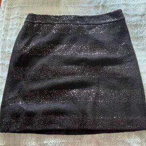 Festive black skirt with sequin borders